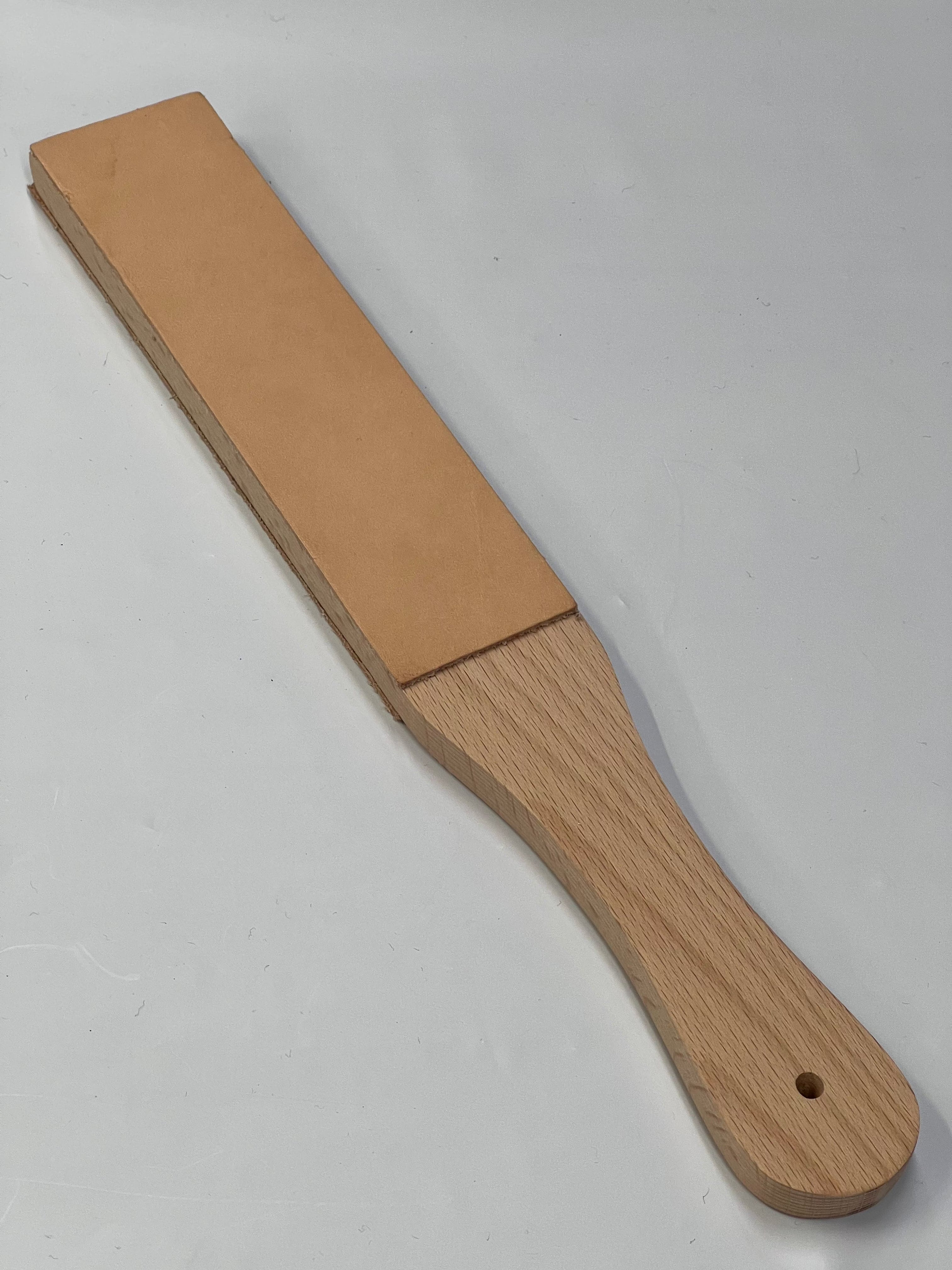 Double-sided leather strap on wooden base RW054